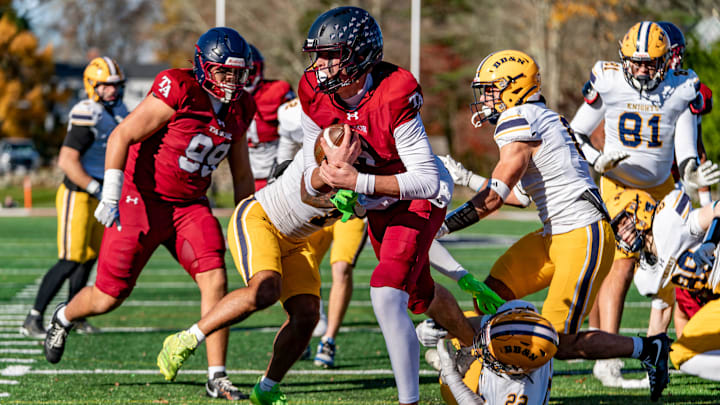 Tabor Academy's quarterback Peter Bourque runs in a touchdown on the opening drive against the BB&N Knights . JOSH SOUZA/STANDARD-TIMES SPECIAL Tabor Academy's quarterback Peter Bourque runs in a touchdown on the opening drive against the BB&N Knights . JOSH SOUZA/STANDARD-TIMES SPECIAL