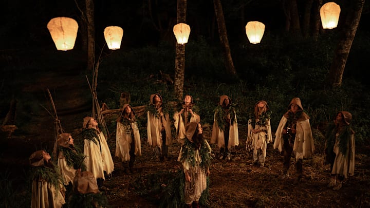 L-R: Anisa Harris as Teen Robin, Vanessa Prasad as Teen Gen, Jenna Burgess as Teen Melissa, Sophie Nélisse as Teen Shauna, Jasmin Savoy Brown as Teen Taissa, Liv Hewson as Teen Van, Courtney Eaton as Teen Lottie, Nia Sondaya as Teen Akilah, Samantha Hanratty as Teen Misty, Kevin Alves as Teen Travis and Silvana Estifanos as Teen Britt in Yellowjackets, episode 1, season 3