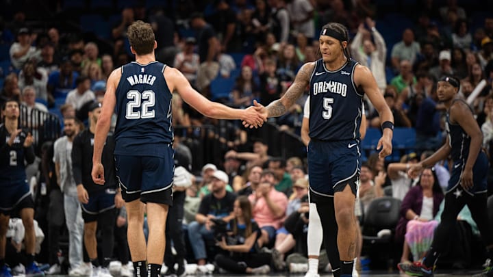 Mar 17, 2024; Orlando, Florida, USA; Orlando Magic forward Paolo Banchero (5) celebrates with Orlando Magic forward Franz Wagner (22) in the fourth quarter against the Toronto Raptors at KIA Center. Mandatory Credit: Jeremy Reper-Imagn Images Mar 17, 2024; Orlando, Florida, USA; Orlando Magic forward Paolo Banchero (5) celebrates with Orlando Magic forward Franz Wagner (22) in the fourth quarter against the Toronto Raptors at KIA Center. Mandatory Credit: Jeremy Reper-Imagn Images
