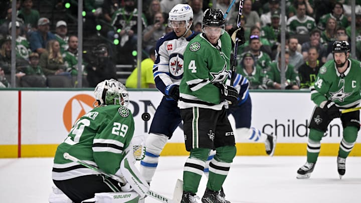 May 13, 2025; Dallas, Texas, USA; Winnipeg Jets center Morgan Barron (36) and Dallas Stars goaltender Jake Oettinger (29) and defenseman Miro Heiskanen (4) look for the puck in the air during the first period in game four of the second round of the 2025 Stanley Cup Playoffs at American Airlines Center. Mandatory Credit: Jerome Miron-Imagn Images May 13, 2025; Dallas, Texas, USA; Winnipeg Jets center Morgan Barron (36) and Dallas Stars goaltender Jake Oettinger (29) and defenseman Miro Heiskanen (4) look for the puck in the air during the first period in game four of the second round of the 2025 Stanley Cup Playoffs at American Airlines Center. Mandatory Credit: Jerome Miron-Imagn Images