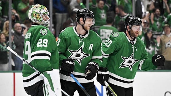 May 25, 2024; Dallas, Texas, USA; Dallas Stars goaltender Jake Oettinger (29) and defenseman Esa Lindell (23) and defenseman Ryan Suter (20) celebrate on the ice after the Dallas Stars defeat the Edmonton Oilers in game two of the Western Conference Final of the 2024 Stanley Cup Playoffs at American Airlines Center. Mandatory Credit: Jerome Miron-USA TODAY Sports
