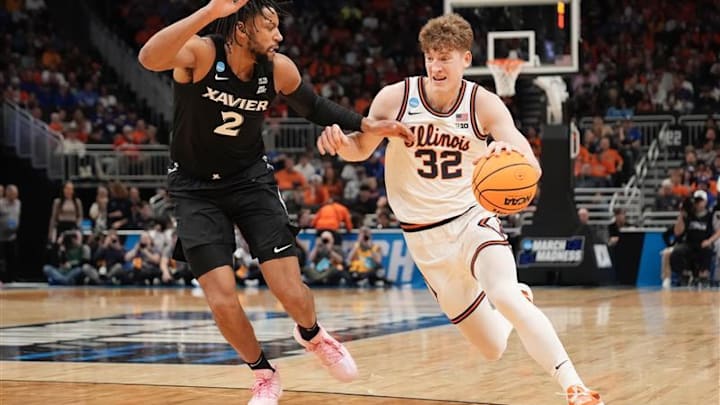 Illinois guard Kasparas Jakucionis (32) drives to the basket against Xavier forward Jerome Hunter (2) in an NCAA Tournament game at Fiserv Forum in Milwaukee, Wisconsin on Friday, March 21, 2025.
