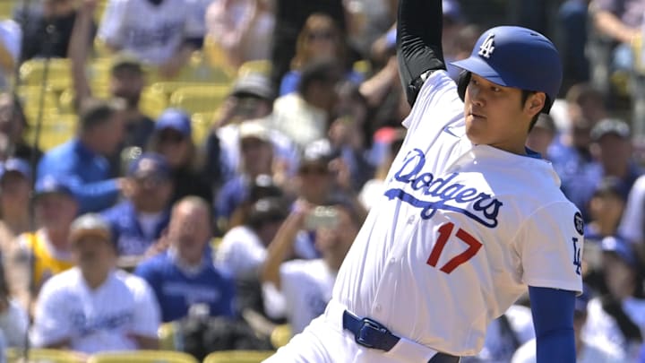 Apr 30, 2025; Los Angeles, California, USA;  Los Angeles Dodgers designated hitter Shohei Ohtani (17) beats the tag by Miami Marlins relief pitcher Luarbert Arias (76) scoring on a wild pitch in the eighth inning at Dodger Stadium. Mandatory Credit: Jayne Kamin-Oncea-Imagn Images