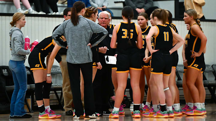 Quitman coach Tim Hooten talks to his team during a timeout of Tuesday's 56-23 win over Bigelow. 