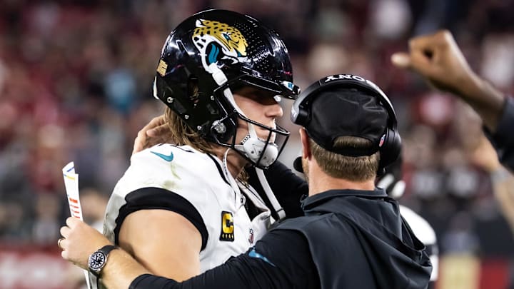 Nov 23, 2025; Glendale, Arizona, USA; Jacksonville Jaguars quarterback Trevor Lawrence (16) celebrates with head coach Liam Coen after defeating the Arizona Cardinals at State Farm Stadium. Mandatory Credit: Mark J. Rebilas-Imagn Images