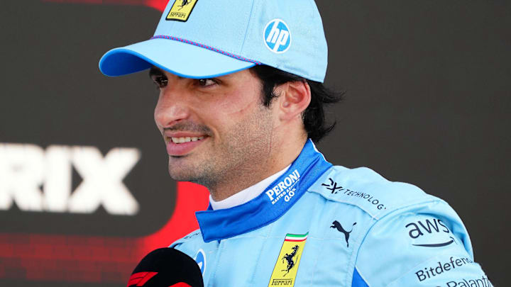 May 4, 2024; Miami Gardens, Florida, USA; Ferrari driver Carlos Sainz (55) talks to the media in the paddock after qualifying P3 for the Miami Grand Prix at Miami International Autodrome. Mandatory Credit: John David Mercer-USA TODAY Sports