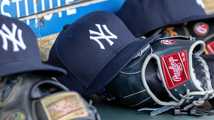 Apr 7, 2025; Detroit, Michigan, USA; New York Yankees baseball hats and gloves in the dugout out in the eighth inning against the Detroit Tigers at Comerica Park. Mandatory Credit: David Reginek-Imagn Images Apr 7, 2025; Detroit, Michigan, USA; New York Yankees baseball hats and gloves in the dugout out in the eighth inning against the Detroit Tigers at Comerica Park. Mandatory Credit: David Reginek-Imagn Images