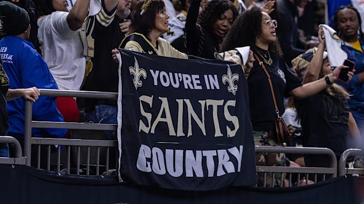 Dec 21, 2025; New Orleans, Louisiana, USA;  New Orleans Saints fans shows support against the New York Jets during the second half  at Caesars Superdome. Mandatory Credit: Stephen Lew-Imagn Images