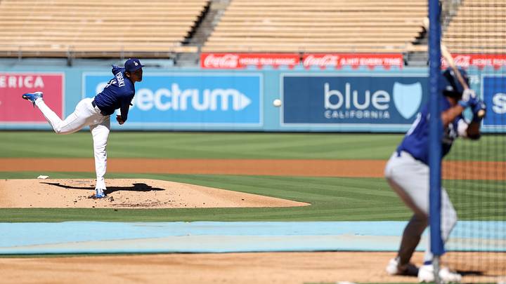 Los Angeles Dodgers pitcher Roki Sasaki (11) pitches in a live batting practice priro to the game against the Cincinnati Reds at Dodger Stadium on Sept. 9. Los Angeles Dodgers pitcher Roki Sasaki (11) pitches in a live batting practice priro to the game against the Cincinnati Reds at Dodger Stadium on Sept. 9.