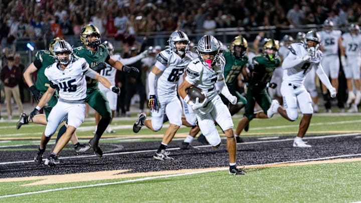 Hamilton Huskies run with the ball against the Basha Bears during a game at Basha High School in Chandler on Oct. 24, 2025.