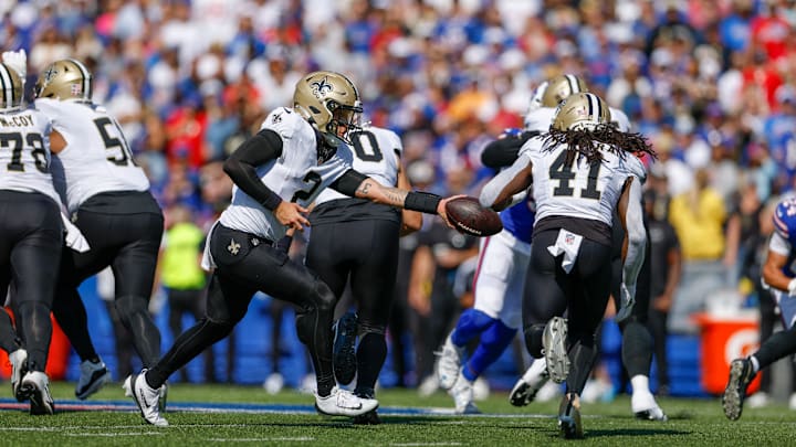 New Orleans Saints quarterback Spencer Rattler (2) hands the ball off to running back Alvin Kamara (41) in a game against the Buffalo Bills on Sep. 28, 2025.