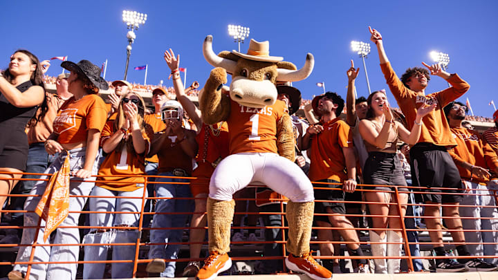 Nov 23, 2024; Austin, Texas, USA; Texas Longhorns mascot Hook Em’ and fans celebrate a touchdown against the Kentucky Wildcats during the first quarter at Darrell K Royal-Texas Memorial Stadium. Mandatory Credit: Brett Patzke-Imagn Images