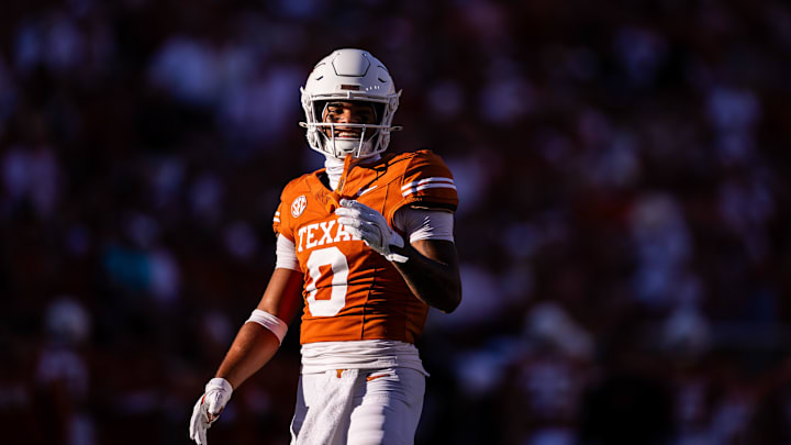 Nov 23, 2024; Austin, Texas, USA; Texas Longhorns wide receiver DeAndre Moore Jr. (0) smiles after a play against the Kentucky Wildcats during the second quarter at Darrell K Royal-Texas Memorial Stadium. Mandatory Credit: Brett Patzke-Imagn Images