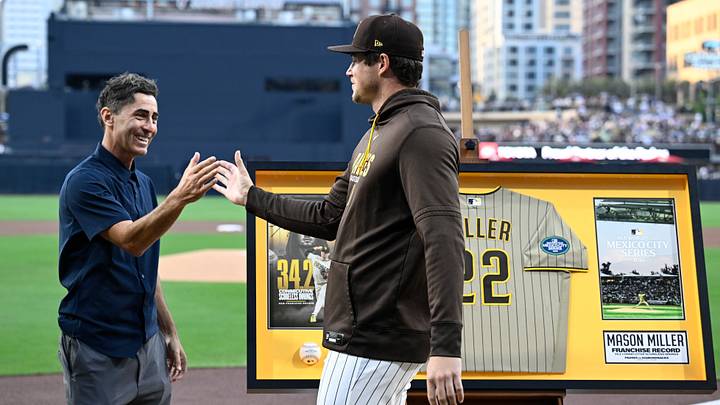 May 7, 2026; San Diego, California, USA; San Diego Padres pitcher Mason Miller (22) is congratulated by general manager A.J. Preller during a ceremony honoring Miller for setting a franchise record for the most consecutive scoreless innings before a game against the St. Louis Cardinals at Petco Park. Mandatory Credit: Denis Poroy-Imagn Images May 7, 2026; San Diego, California, USA; San Diego Padres pitcher Mason Miller (22) is congratulated by general manager A.J. Preller during a ceremony honoring Miller for setting a franchise record for the most consecutive scoreless innings before a game against the St. Louis Cardinals at Petco Park. Mandatory Credit: Denis Poroy-Imagn Images