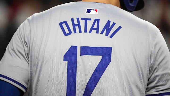 Sep 2, 2024; Phoenix, Arizona, USA; The details of the jersey of Los Angeles Dodgers two-way player Shohei Ohtani (17) during the ninth inning of the game against the Arizona Diamondbacks at Chase Field. Mandatory Credit: Joe Camporeale-Imagn Images