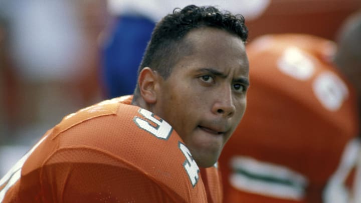 Unknown Date; Miami, FL, USA; FILE PHOTO; Miami Hurricanes defensive tackle (94) Dwayne Johnson on the bench during the 1994 season at the Orange Bowl. Johnson went on to become a professional wrestler and actor known as "The Rock". Mandatory Credit: Photo By Imagn Images (c) Copyright Imagn Images Unknown Date; Miami, FL, USA; FILE PHOTO; Miami Hurricanes defensive tackle (94) Dwayne Johnson on the bench during the 1994 season at the Orange Bowl. Johnson went on to become a professional wrestler and actor known as "The Rock". Mandatory Credit: Photo By Imagn Images (c) Copyright Imagn Images