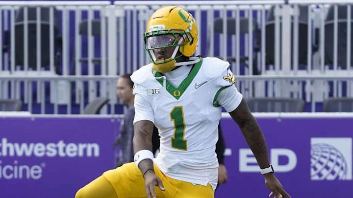 Sep 13, 2025; Evanston, Illinois, USA; Oregon Ducks wide receiver Dakorien Moore (1)  warms up against the Northwestern Wildcats during the second half at Northwestern Medicine Field at Martin Stadium. Mandatory Credit: David Banks-Imagn Images