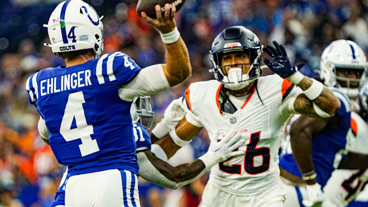 Indianapolis Colts quarterback Sam Ehlinger (4) throws a pass over Denver Broncos safety Devon Key (26) during a pre-season game between the Indianapolis Colts and the Denver Broncos on Sunday, August. 11, 2024 at Lucas Oil Stadium in Indianapolis. Indianapolis Colts quarterback Sam Ehlinger (4) throws a pass over Denver Broncos safety Devon Key (26) during a pre-season game between the Indianapolis Colts and the Denver Broncos on Sunday, August. 11, 2024 at Lucas Oil Stadium in Indianapolis.
