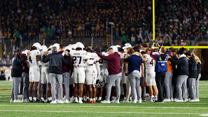 Texas A&M prays as safety Bryce Anderson (1) receives care from medical staff in the first half of a NCAA football game against Notre Dame at Notre Dame Stadium on Saturday, Sept. 13, 2025, in South Bend.