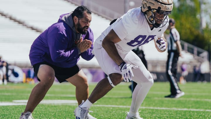Jordan PaoPao instructs tight end Quentin Moore during spring ball. 