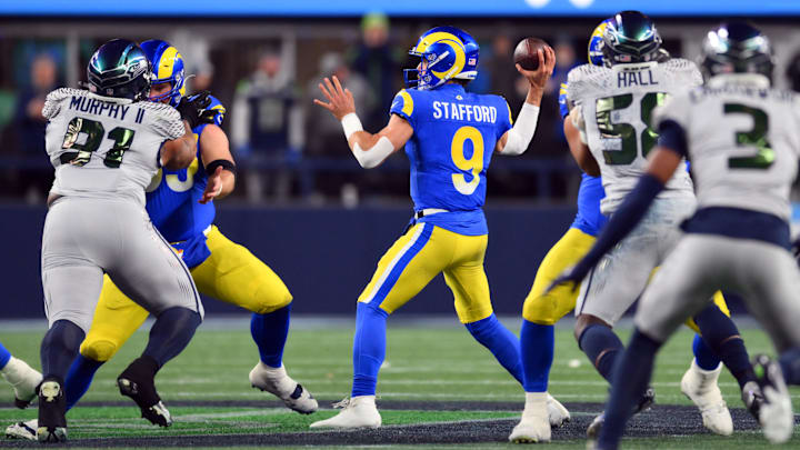 Dec 18, 2025; Seattle, Washington, USA; Los Angeles Rams quarterback Matthew Stafford (9) throws a pass against the Seattle Seahawks in the first half at Lumen Field. Mandatory Credit: Steven Bisig-Imagn Images