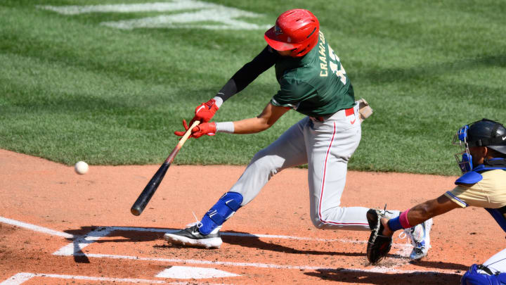 Jul 8, 2023; Seattle, Washington, USA; National League Futures designated hitter Justin Crawford (13) of the Philadelphia Phillies hits an RBI sacrifice fly against the American League during the second inning of the All Star-Futures game at T-Mobile Park. 