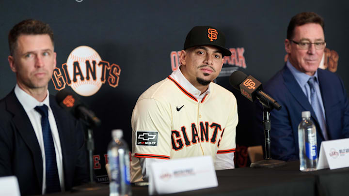 Dec 12, 2024; San Francisco, CA, USA; San Francisco Giants shortstop Willy Adames listens during his introductory press conference with president of baseball operations Buster Posey (left) and manager Bob Melvin (right) at Oracle Park. Dec 12, 2024; San Francisco, CA, USA; San Francisco Giants shortstop Willy Adames listens during his introductory press conference with president of baseball operations Buster Posey (left) and manager Bob Melvin (right) at Oracle Park.