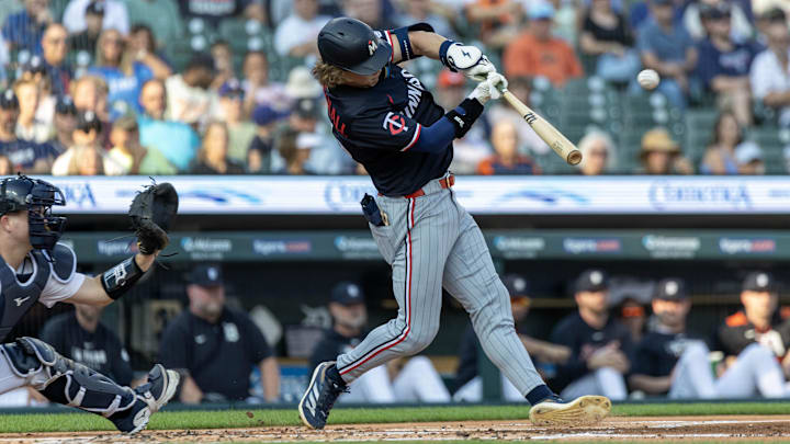 Aug 5, 2025; Detroit, Michigan, USA; Minnesota Twins outfielder Luke Keaschall (15) hits a two run home run in the first inning against the Detroit Tigers at Comerica Park. Mandatory Credit: David Reginek-Imagn Images