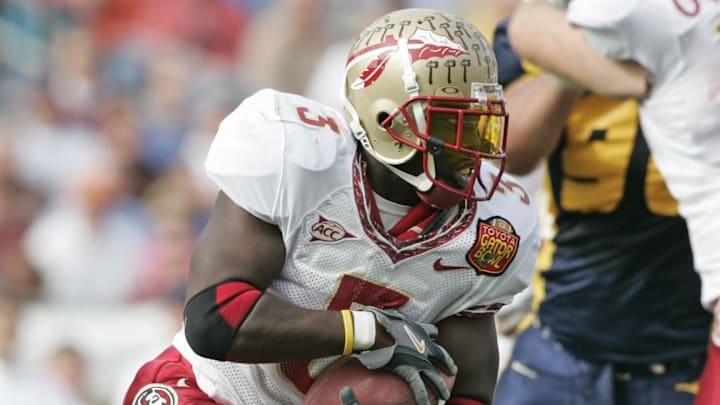 Jan 01, 2005; Jacksonville, FL, USA;  Florida State Seminoles runningback Leon Washington runs past the West Virginia Mountaineers defenders during the first quarter in the 2005 Toyota Gator Bowl held at Alltel Stadium. FSU defeated West Virginia 30-18. Mandatory Credit: Photo by Imagn Images (©) Copyright 2004 by Preston Mack