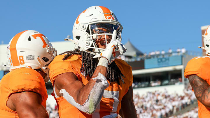 Sep 27, 2025; Starkville, Mississippi, USA; Tennessee Volunteers wide receiver Chris Brazzell II (17) and wide receiver Braylon Staley (14) celebrate after a touchdown against the Mississippi State Bulldogs during the first half at Davis Wade Stadium at Scott Field. Mandatory Credit: Wesley Hale-Imagn Images