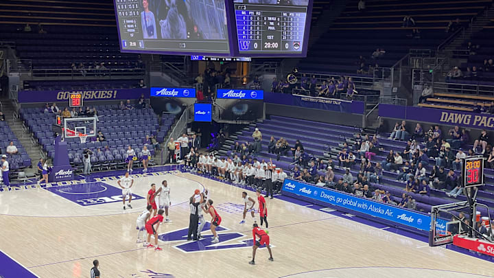 The UW and Western Oregon tipped off in an exhibition before a small crowd at Alaska Airlines Arena. 