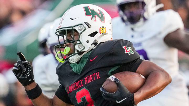Lawrence North Wildcats Izayveon Moore (3) runs the ball. Lawrence North Wildcats Izayveon Moore (3) runs the ball.