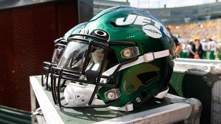 Aug 21, 2021; Green Bay, Wisconsin, USA;  New York Jets helmets sit on the sidelines during the game against the Green Bay Packers at Lambeau Field. Mandatory Credit: Jeff Hanisch-Imagn Images