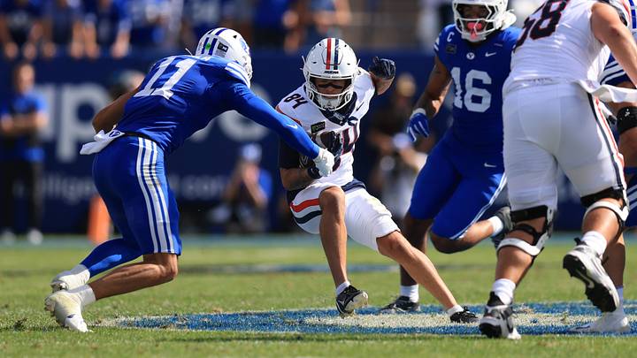 Sep 12, 2026; Provo, Utah, USA;  Arizona Wildcats wide receiver Rodney Gallagher III (84) runs against BYU Cougars safety Faletau Satuala (11) and linebacker Isaiah Glasker (16) during the second half at LaVell Edwards Stadium.  Mandatory Credit: Rob Gray-Imagn Images