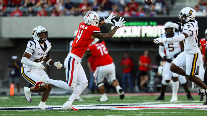 Oct 26, 2024; Tucson, Arizona, USA; Arizona Wildcats wide receiver Tetairoa McMillan (4) catches the ball during the second quarter against the West Virginia Mountaineers at Arizona Stadium. Mandatory Credit: Aryanna Frank-Imagn Images Oct 26, 2024; Tucson, Arizona, USA; Arizona Wildcats wide receiver Tetairoa McMillan (4) catches the ball during the second quarter against the West Virginia Mountaineers at Arizona Stadium. Mandatory Credit: Aryanna Frank-Imagn Images