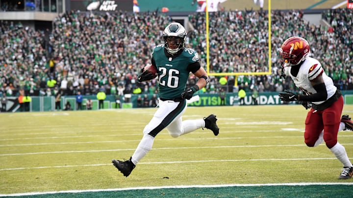 Jan 26, 2025; Philadelphia, PA, USA; Philadelphia Eagles running back Saquon Barkley (26) runs with the ball for a touchdown against the Washington Commanders during the first half in the NFC Championship game at Lincoln Financial Field. Mandatory Credit: Eric Hartline-Imagn Images