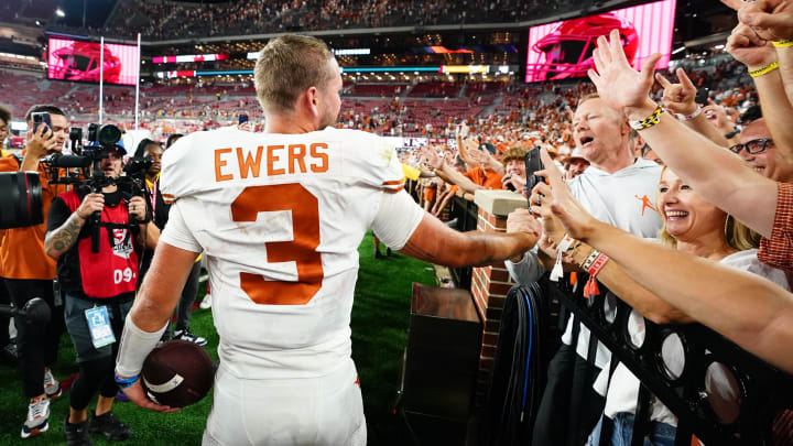 Sep 9, 2023; Tuscaloosa, Alabama, USA; Texas Longhorns quarterback Quinn Ewers (3) celebrates with his parents on their 34-24 victory over the Alabama Crimson Tide at Bryant-Denny Stadium. Mandatory Credit: John David Mercer-USA TODAY Sports