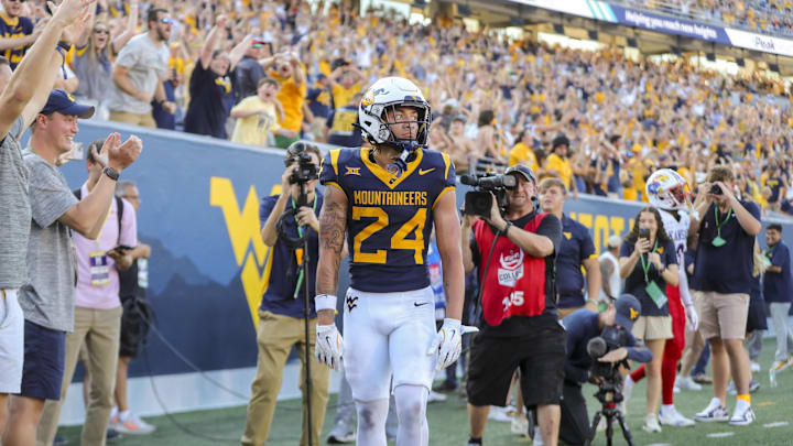 Sep 21, 2024; Morgantown, West Virginia, USA; West Virginia Mountaineers wide receiver Rodney Gallagher III (24) catches a pass for a touchdown late during the fourth quarter against the Kansas Jayhawks at Mountaineer Field at Milan Puskar Stadium. Mandatory Credit: Ben Queen-Imagn Images Sep 21, 2024; Morgantown, West Virginia, USA; West Virginia Mountaineers wide receiver Rodney Gallagher III (24) catches a pass for a touchdown late during the fourth quarter against the Kansas Jayhawks at Mountaineer Field at Milan Puskar Stadium. Mandatory Credit: Ben Queen-Imagn Images