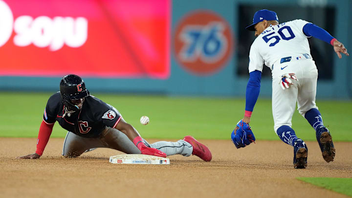 Mar 30, 2026: Cleveland Guardians right fielder Angel Martinez (1) steals second base against Los Angeles Dodgers shortstop Mookie Betts (50) during the fifth inning at Dodger Stadium. Mar 30, 2026: Cleveland Guardians right fielder Angel Martinez (1) steals second base against Los Angeles Dodgers shortstop Mookie Betts (50) during the fifth inning at Dodger Stadium.