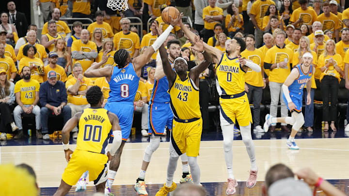 Jun 13, 2025; Indianapolis, Indiana, USA; Oklahoma City Thunder forward Jalen Williams (8) reaches for the ball against Indiana Pacers forward Pascal Siakam (43) and guard Tyrese Haliburton (0) during the first half during game four of the 2025 NBA Finals at Gainbridge Fieldhouse. Mandatory Credit: Kyle Terada-Imagn Images