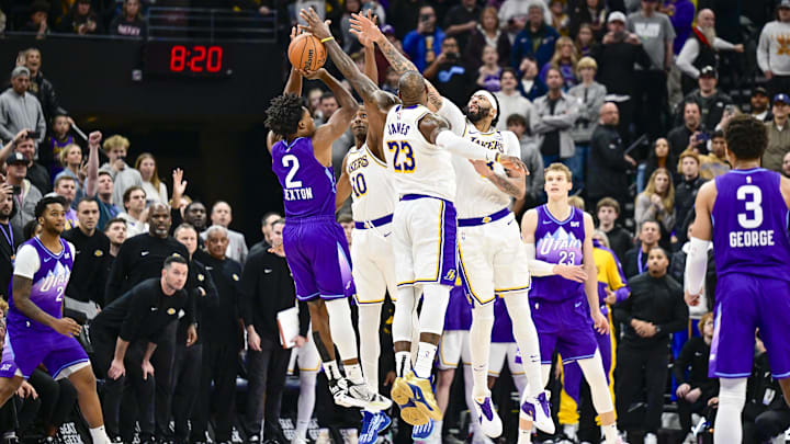 Dec 1, 2024; Salt Lake City, Utah, USA; Utah Jazz guard Collin Sexton (2) gets blocked by Los Angeles Lakers forward LeBron James (23), forward/center Anthony Davis (3), and center Christian Koloko (10) in the final second of the second half at the Delta Center. Mandatory Credit: Christopher Creveling-Imagn Images