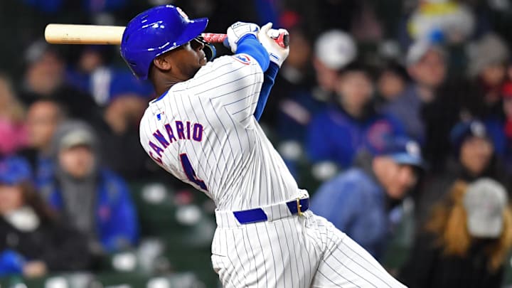 Apr 20, 2024; Chicago, Illinois, USA; Chicago Cubs outfielder Alexander Canario (4) hits a home run during the sixth inning against the Miami Marlins at Wrigley Field