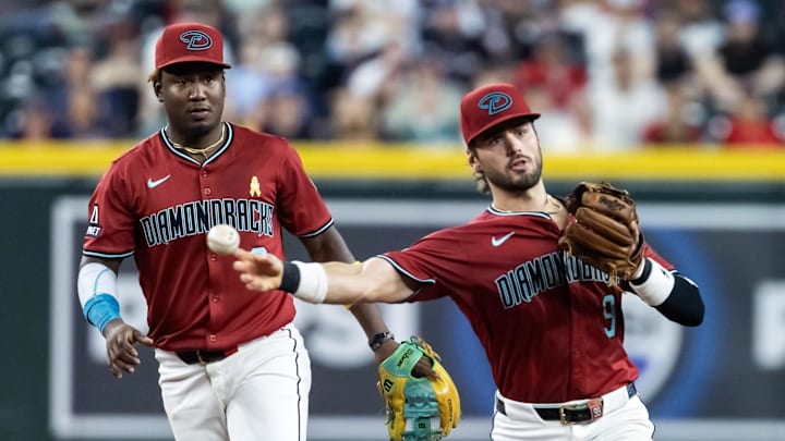 Sep 7, 2025; Phoenix, Arizona, USA; Arizona Diamondbacks infielders Blaze Alexander (right) and Geraldo Perdomo against the Boston Red Sox at Chase Field. Mandatory Credit: Mark J. Rebilas-Imagn Images Sep 7, 2025; Phoenix, Arizona, USA; Arizona Diamondbacks infielders Blaze Alexander (right) and Geraldo Perdomo against the Boston Red Sox at Chase Field. Mandatory Credit: Mark J. Rebilas-Imagn Images