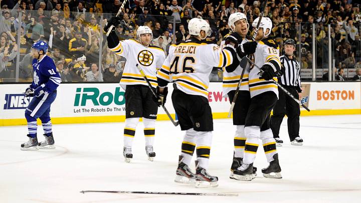 December 3, 2011; Boston, MA, USA; Boston Bruins right wing Nathan Horton (18) (right) is congratulated by left wing Milan Lucic (17) (middle) and center David Krejci (46) after scoring a goal during the third period at TD Garden. Mandatory Credit: Bob DeChiara-USA TODAY Sports