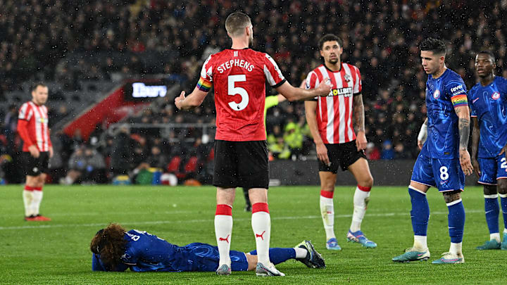 Marc Cucurella lays on the ground after Jack Stephens pulled his hair prior to a Southampton corner.