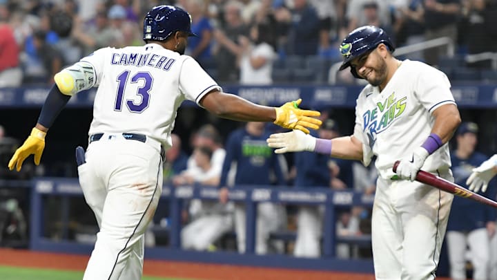 Apr 24, 2026; St. Petersburg, Florida, USA; Tampa Bay Rays infielder Junior Caminero (13) celebrates a home run with Tampa Bay Rays infielder Jonathan Aranda (8) at Tropicana Field.