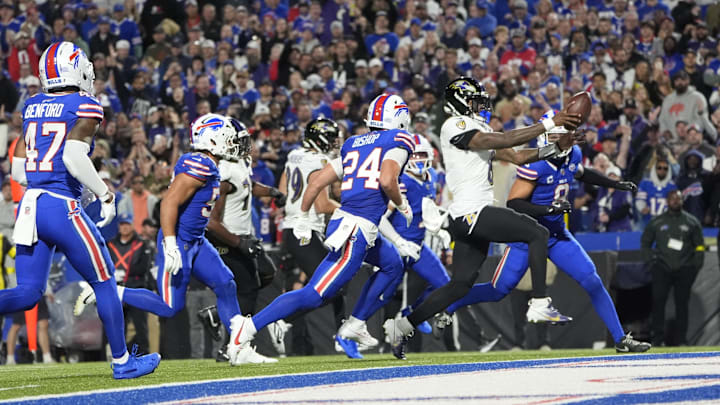 Sep 7, 2025; Orchard Park, New York, USA;  Baltimore Ravens quarterback Lamar Jackson (8) scores a touchdown  during the second quarter against the Buffalo Bills