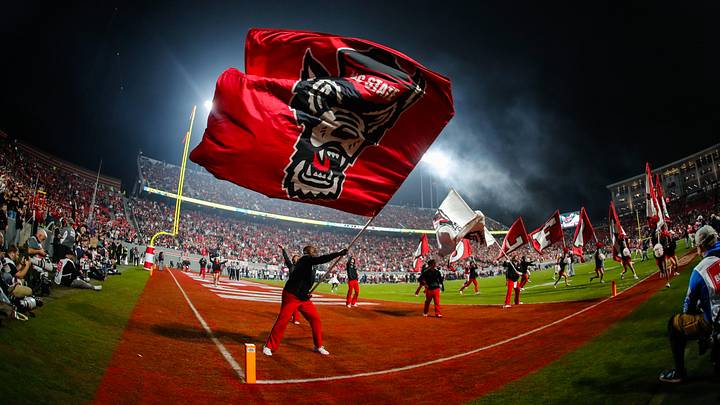 Nov 21, 2025; Raleigh, North Carolina, USA; NC State Wolfpack cheerleader celebrates a touchdown during the second half of the game against Florida State Seminoles at Carter-Finley Stadium. Mandatory Credit: Jaylynn Nash-Imagn Images Nov 21, 2025; Raleigh, North Carolina, USA; NC State Wolfpack cheerleader celebrates a touchdown during the second half of the game against Florida State Seminoles at Carter-Finley Stadium. Mandatory Credit: Jaylynn Nash-Imagn Images