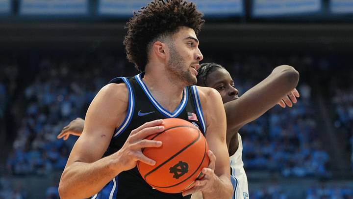 Feb 7, 2026; Chapel Hill, North Carolina, USA; Duke Blue Devils forward Cameron Boozer (12) grabs the rebound over North Carolina Tar Heels forward Caleb Wilson (8) in the second half at Dean E. Smith Center. Mandatory Credit: Bob Donnan-Imagn Images Feb 7, 2026; Chapel Hill, North Carolina, USA; Duke Blue Devils forward Cameron Boozer (12) grabs the rebound over North Carolina Tar Heels forward Caleb Wilson (8) in the second half at Dean E. Smith Center. Mandatory Credit: Bob Donnan-Imagn Images