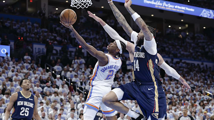 Oklahoma City Thunder guard Shai Gilgeous-Alexander (2) goes to the basket in front of New Orleans Pelicans forward Brandon Ingram (14) during the fourth quarter of game one of the first round for the 2024 NBA playoffs at Paycom Center. Mandatory Credit: Alonzo Adams-Imagn Images